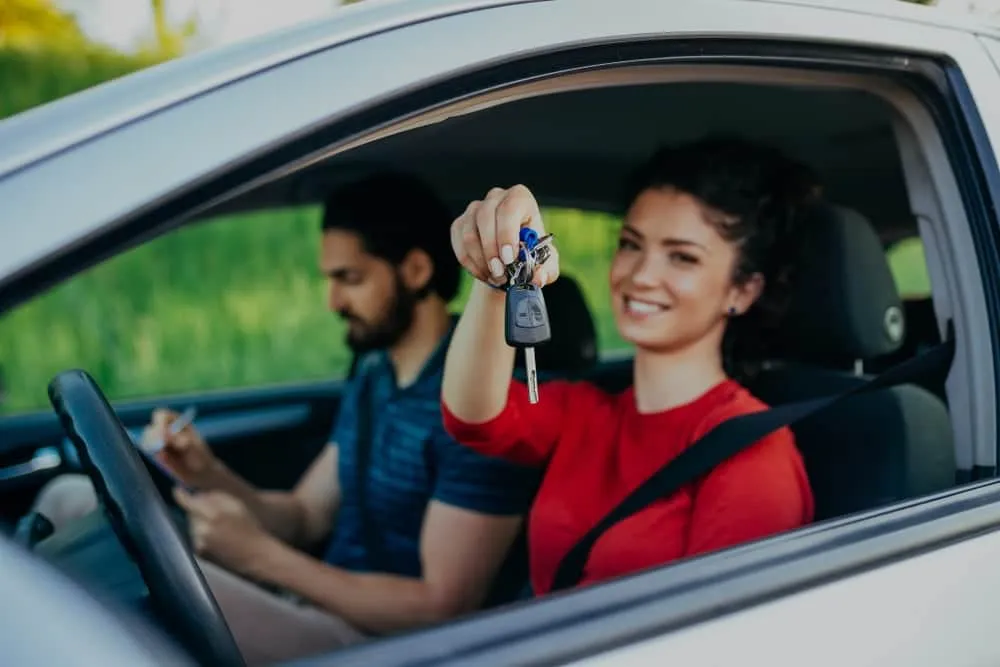 Student celebrating with car keys