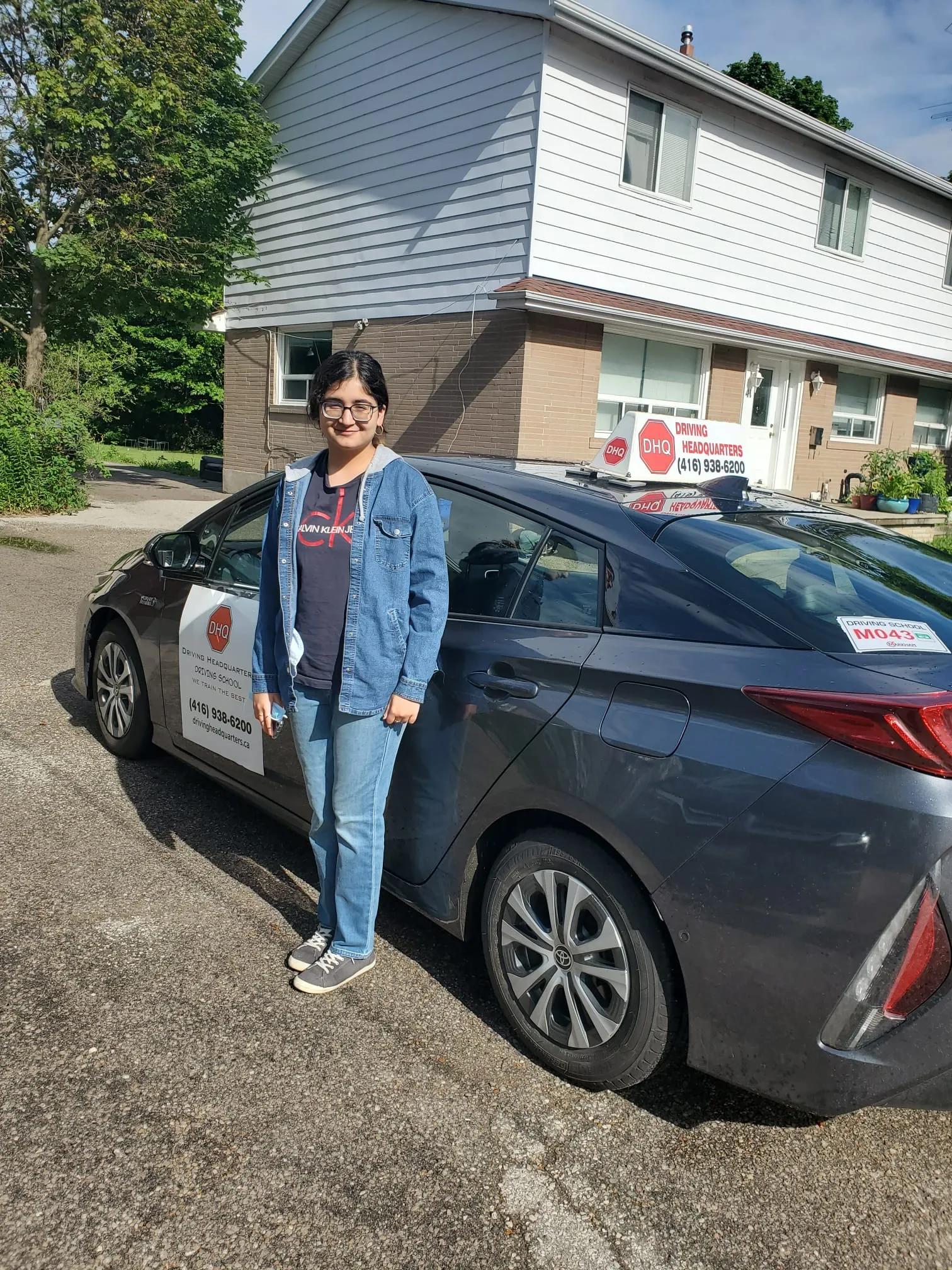 DHQ student with driving school car